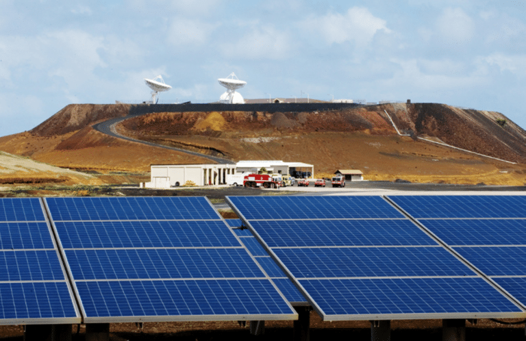 Solar panel array at the base of a mountain